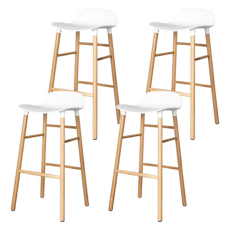 Modern Counter Bar Stool Armless Plastic Indoor Bar Stool with Footrest and Wood Base White 4 Piece Set Clearhalo 'Bar Furniture' 'Bar Stools' 'bar_stools' 'furn' 'furn_bar_stools' 'furniture_bar_stools' 'Kitchen & Dining Furniture' 'kitchen&dining_furn' 'kitchen' 'kitchen_furn' Furniture' 4184411