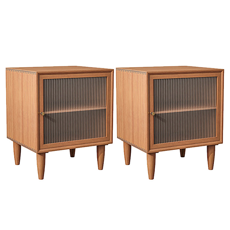 Portes d'armoires de chevet en bois massif comprenant une table de nuit moderne avec des jambes