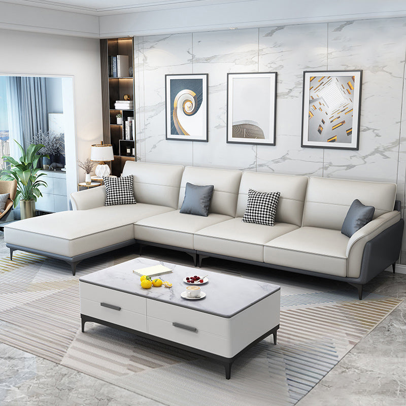 Divano e chaise di divano armato svasato in fenomeno in cuscino in pelle.