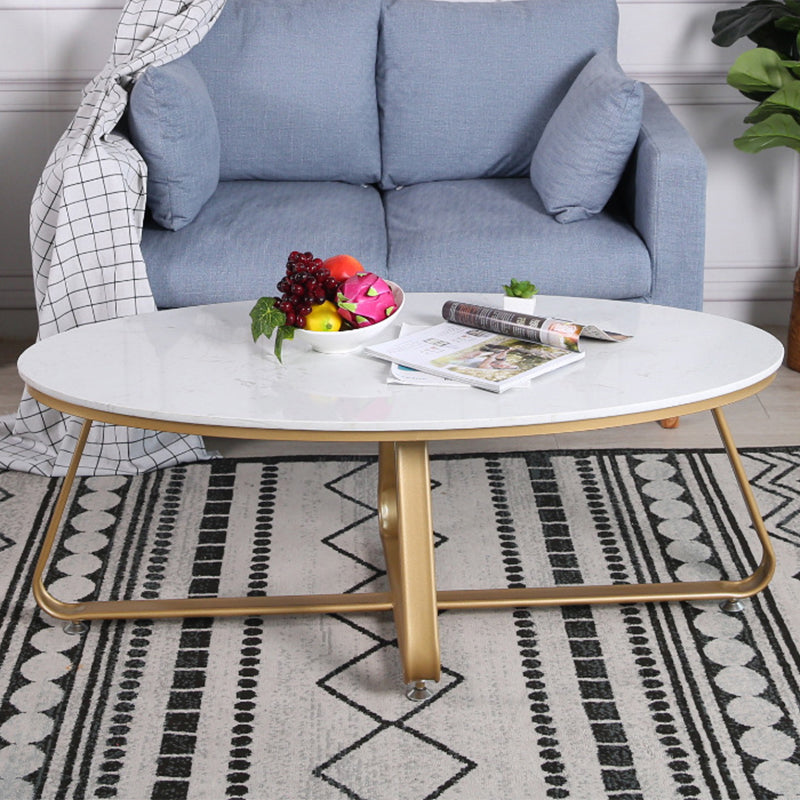 Glam Style Cocktail Table with Oval Top and Golden Iron Cross Base
