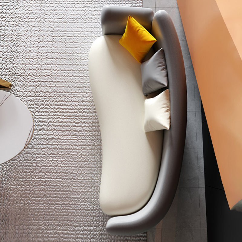 Divano curvo con posteriore stretto contemporaneo con cuscino, divano a braccio di smoking in pelle