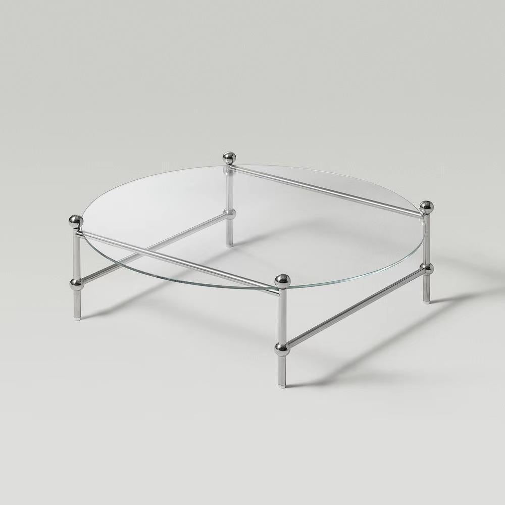 Tavolino rotondo contemporaneo con top in vetro e gambe in acciaio in chiaro