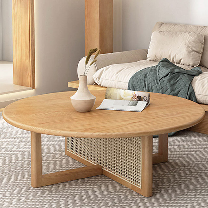Mesa de café redonda escandinava con patas cruzadas en madera de pino