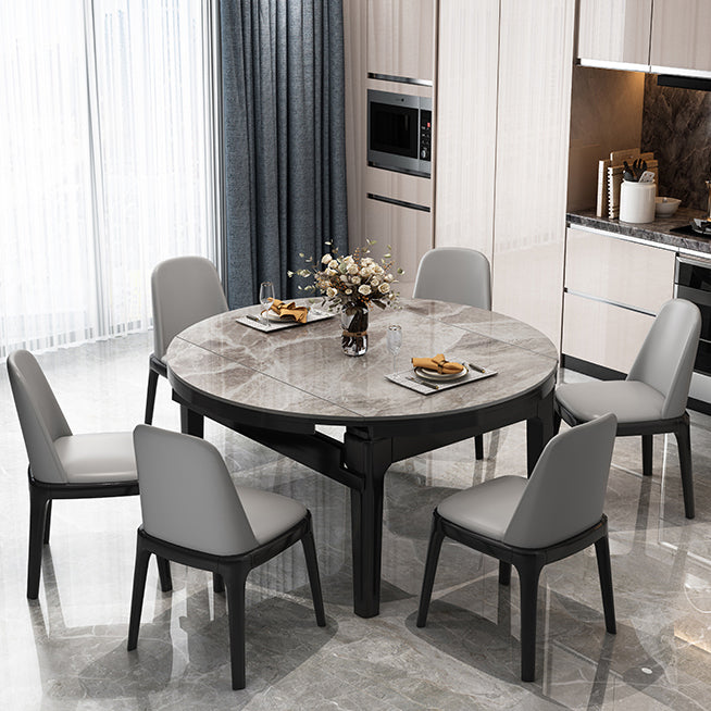 Moderner runder graues Steinoberteil ausziehbar einziehbarer Esstisch mit 4 schwarzen Beinen mit Gummiholzbeinen