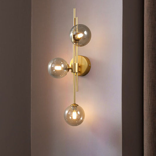 Designer Ball Wall Light Sconce Glass 3-Head Bedroom Wall Mounted Lighting in Brass Clearhalo 'Cast Iron' 'Glass' 'Industrial' 'Modern wall lights' 'Modern' 'Tiffany' 'Traditional wall lights' 'Wall Lamps & Sconces' 'Wall Lights' Lighting' 2254632