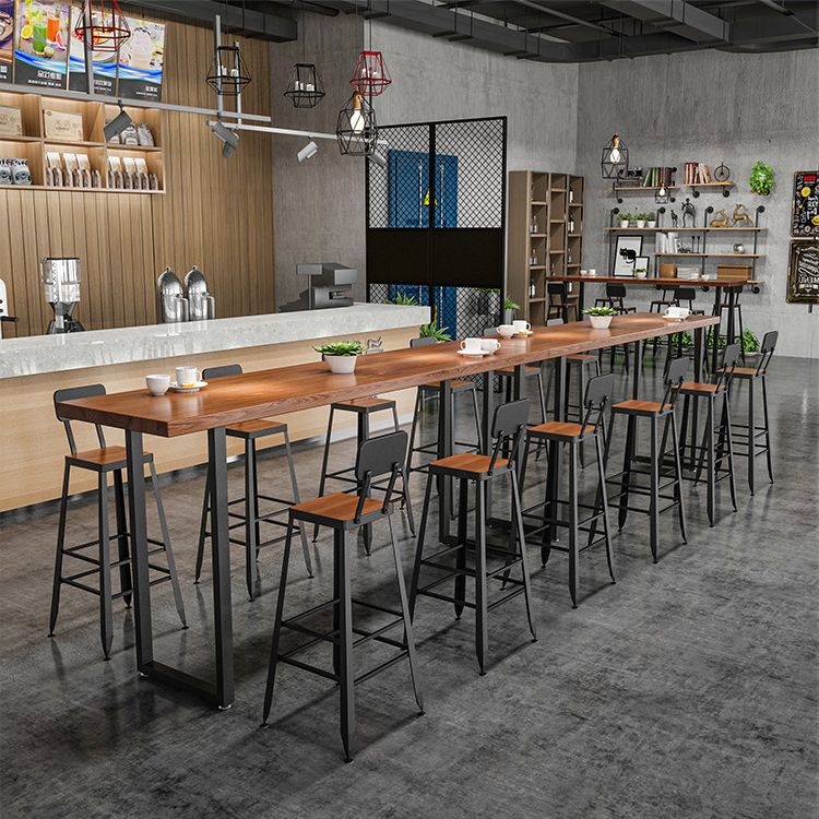 Vaste houten staaf eettafel industriële rechthoekige staaftafel met slee -basis in zwart