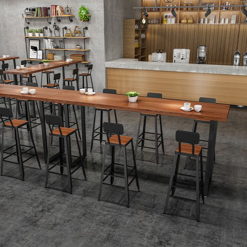 Vaste houten staaf eettafel industriële rechthoekige staaftafel met slee -basis in zwart