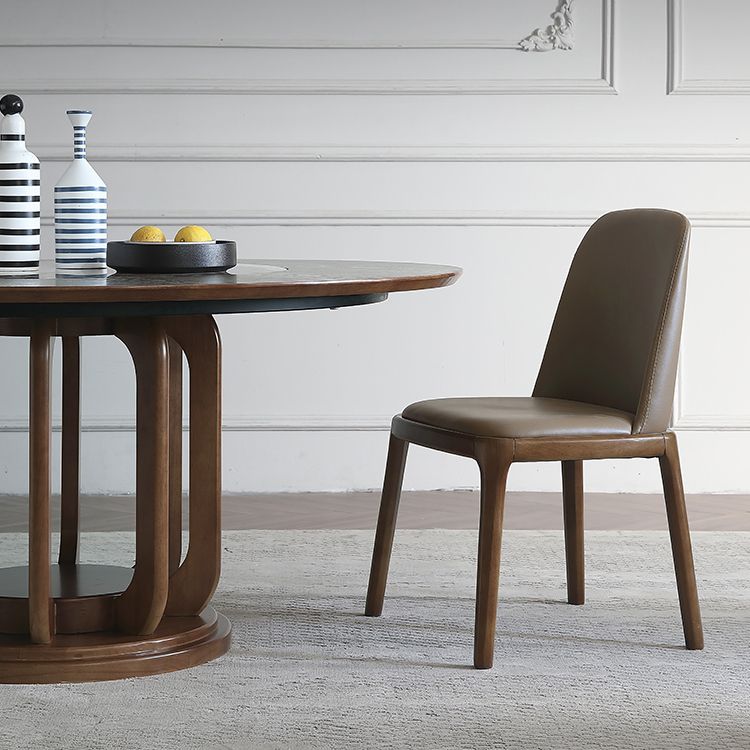 Eigentijdse ronde eettafel bruine as houten voetstuktafel