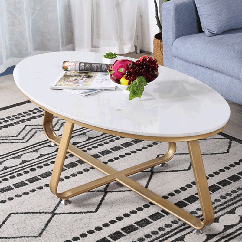 Glam Style Cocktail Table with Oval Top and Golden Iron Cross Base