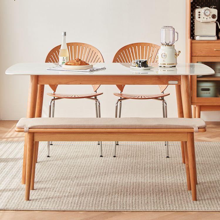 4つの木製の脚のあるモダンな長方形のダイニングテーブル焼結石上部テーブル