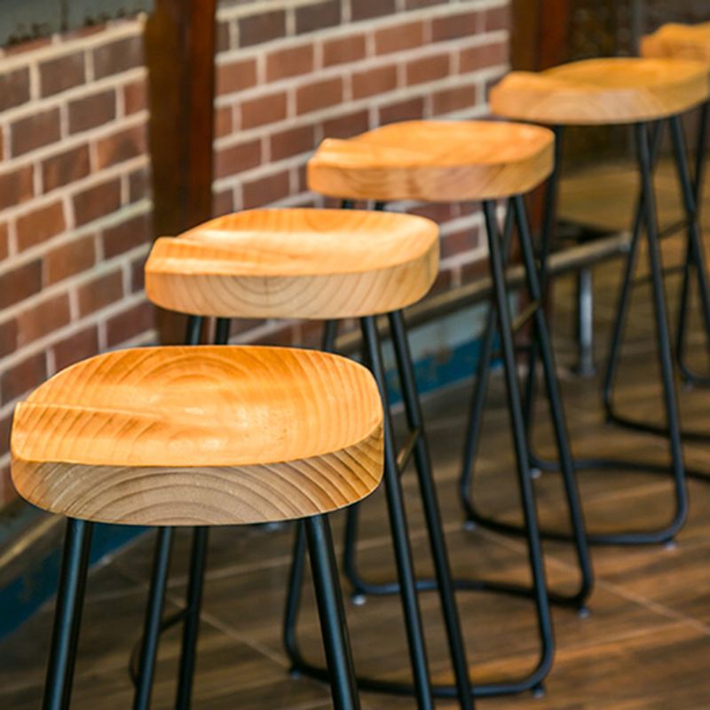 Modern Indoor Bar Stool Solid Wood Iron Legs Saddle Seat Counter Stool Clearhalo 'Bar Furniture' 'Bar Stools' 'bar_stools' 'furn' 'furn_bar_stools' 'furniture_bar_stools' 'Kitchen & Dining Furniture' 'kitchen&dining_furn' 'kitchen' 'kitchen_furn' Furniture' 1200x1200_14e25f16-8ac7-4cc1-a5d2-dd18b468a53b