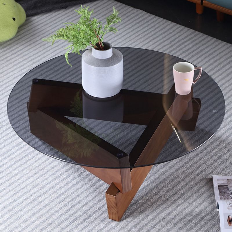 Tavolo da cocktail tondo in vetro con base in legno massiccio