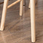 Tabouret de bar contemporain en bois massif avec siège profilé sans dossier et repose-pieds