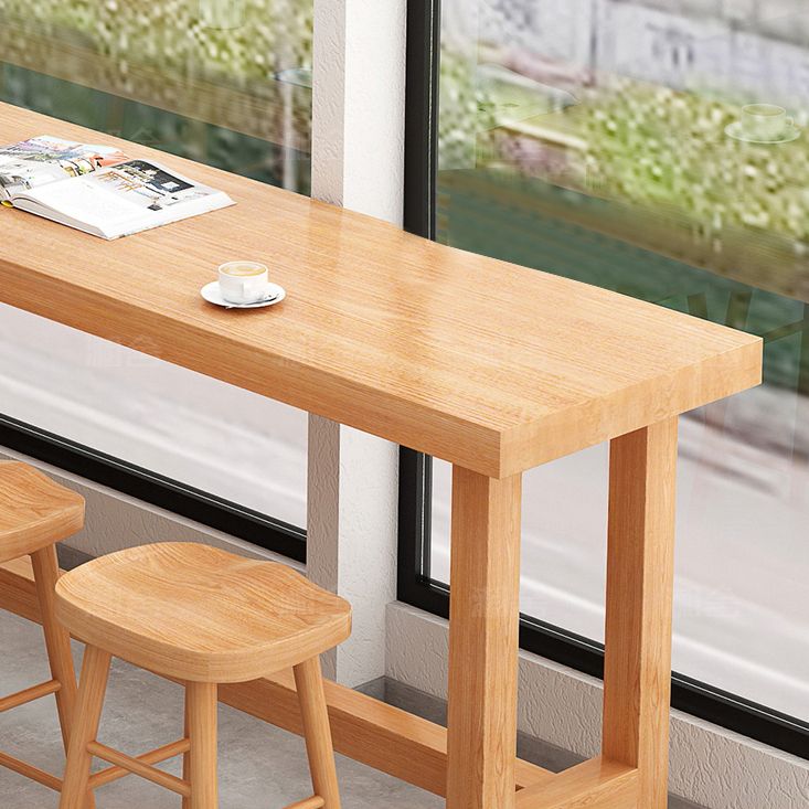 Modern Beige Wood Bar Dining Table Rectangle Indoor Bistro Table with Footrest Clearhalo 'Bar Furniture' 'Bar Tables' 'bar_tables' 'furn' 'furn_bar_tables' 'Furniture' 'furniture_bar_tables' 'Kitchen & Dining Furniture' 1200x1200_1c15b17a-31d2-436f-aab3-06196982c4cd