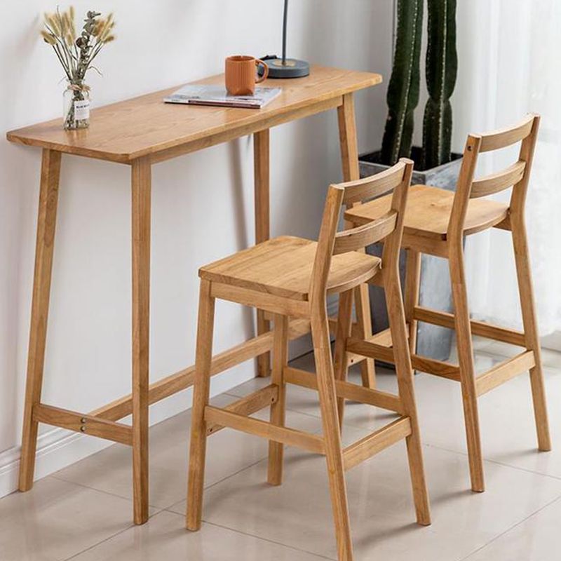 Tavolo da bar rettangolo contemporaneo banda bar a barre in legno massello con poggiapiedi