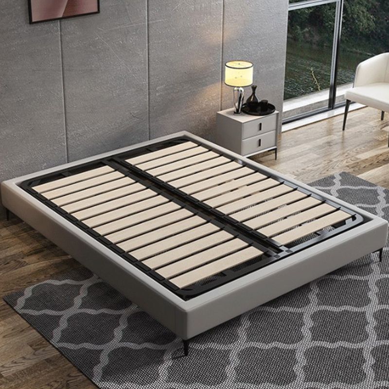 Piattaforma grigio scuro letto in legno e piattaforma imbottita con gambe metalliche