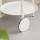 Table d'appoint supérieur du plateau rond du milieu du siècle du milieu du siècle avec roue et étagère