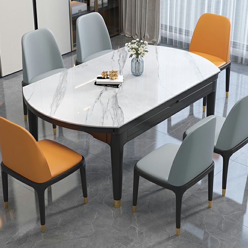 Luxe ronde grijze stenen topverlenging eettafel met 4 zwarte en gouden poten