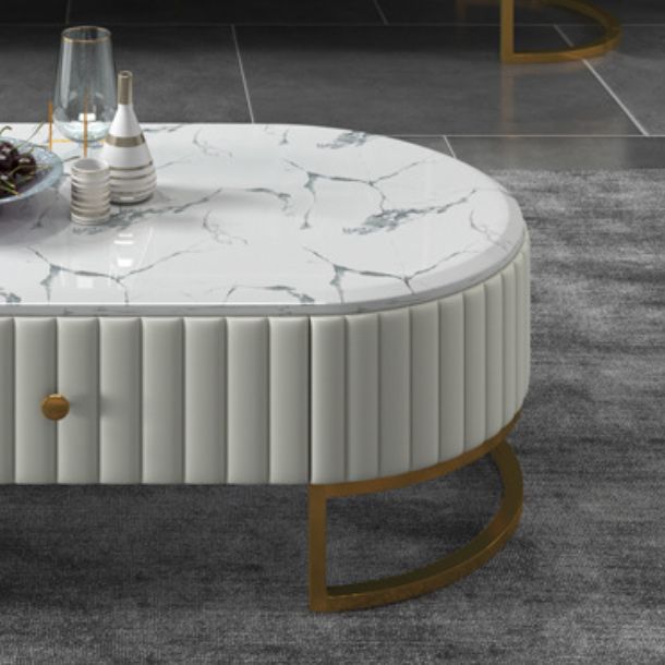 Tavolino ovale in stile glam con 1 cassetto e top in pietra e base di ferro