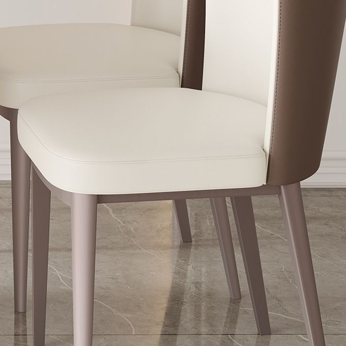 Moderne eenvoudige zijstoel faux lederen eetkamerstoel met metalen basis voor huisgebruik