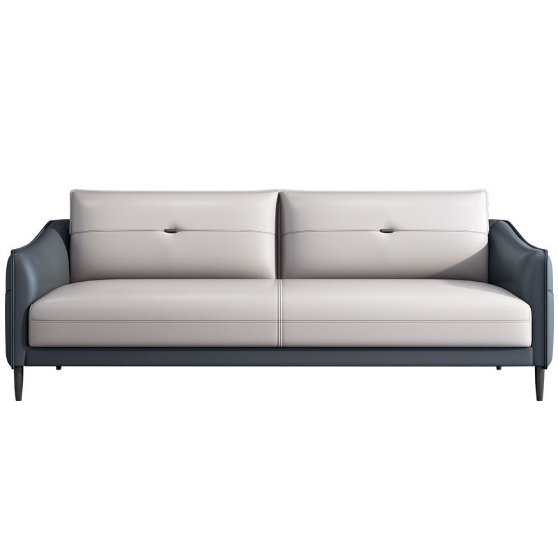 Sofá de cuero gris con cuatro patas sueltas de estilo nórdico de espalda