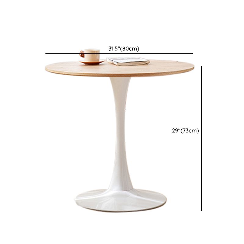Tavolo da pranzo rotondo moderno con piano in legno naturale con base a tulipano