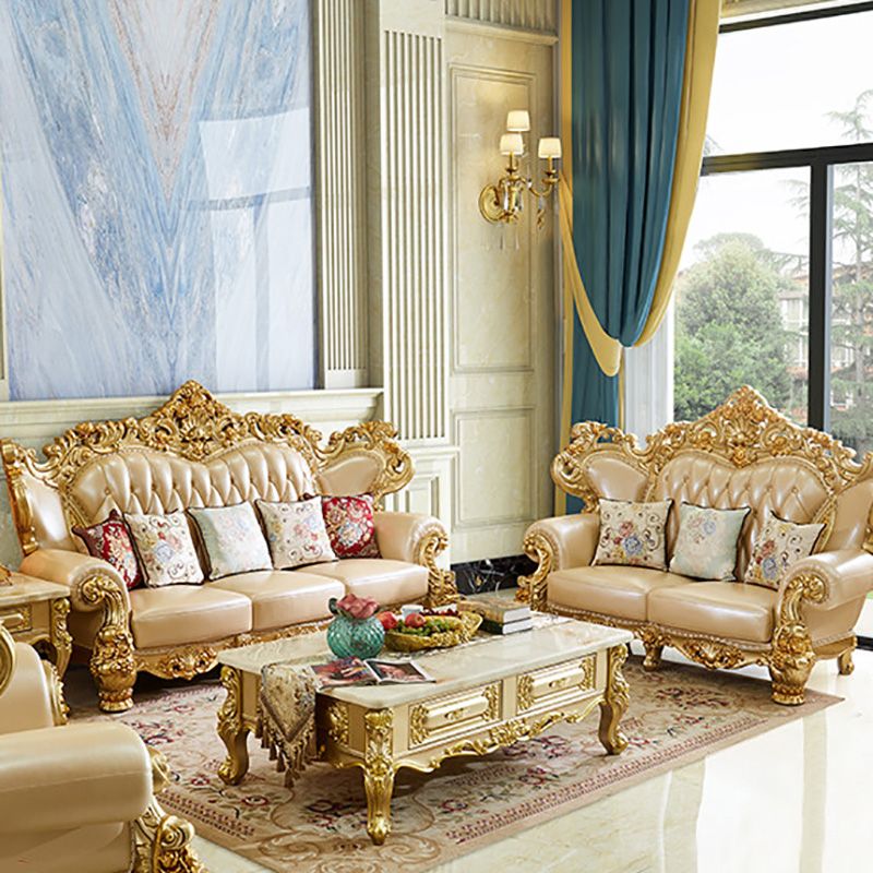 ゴールドの本革ソファ房式スプリットバックロールアームソファリビングルーム用