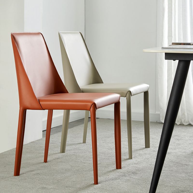 Eigentijdse lederen armloze eetkamerstoel Metalen eetkamerstoelen voor thuisgebruik