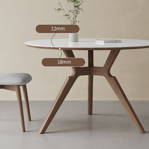 Eigentijdse ronde witte stenen eettafel met massief houten schroefdeksel