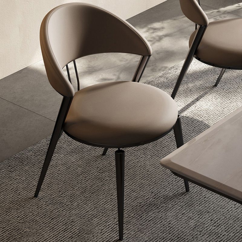 Minimalistische stijl armloze open achterkant stoelen faux lederen eetkamerstoelen