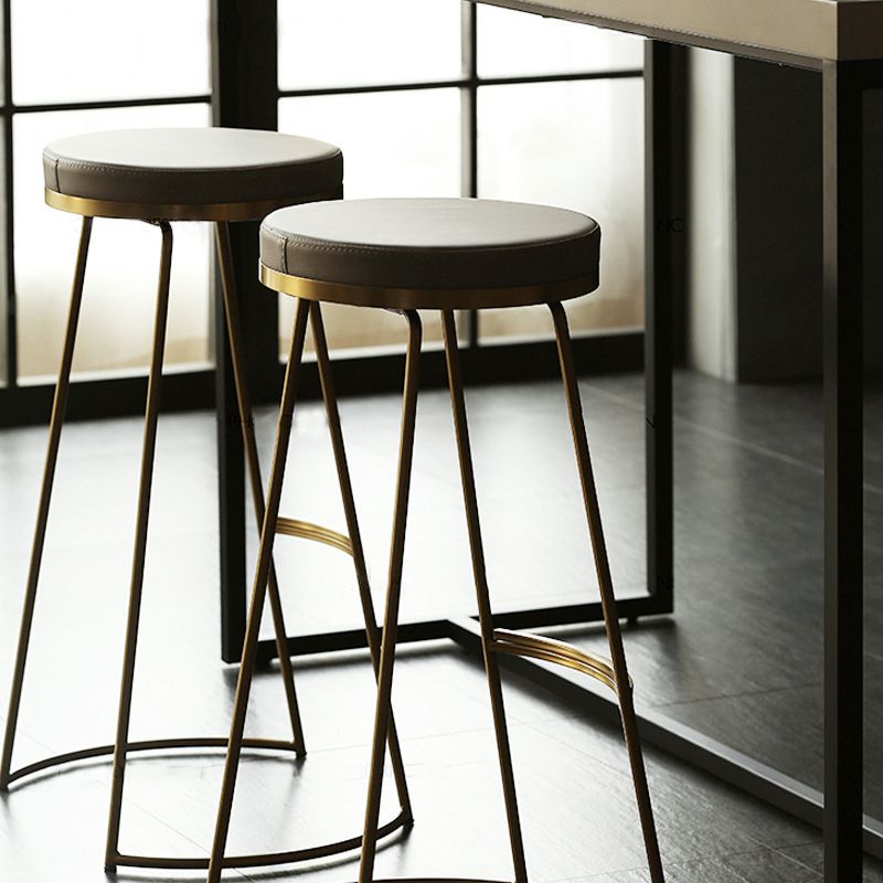 Tabouret de comptoir rond en similicuir moderne, sans dossier, avec repose-pieds