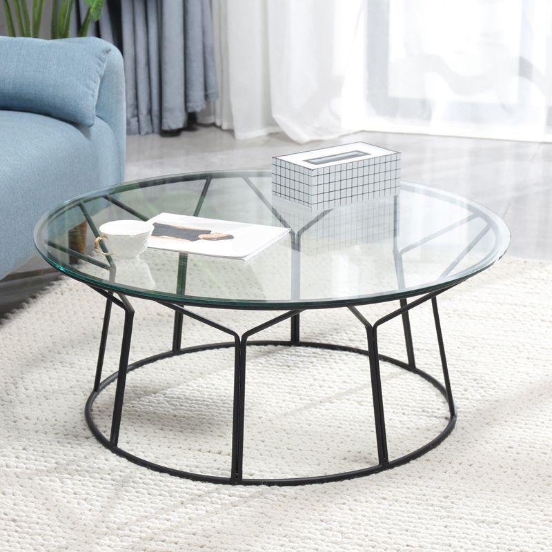 Tavolino contemporaneo con top in vetro rotondo e base di ferro