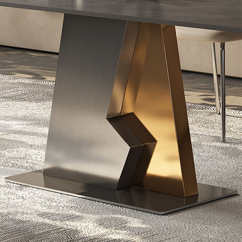 Table à manger en pierre industrielle industrielle dans une table à manger rectangulaire gris avec base de piédestal