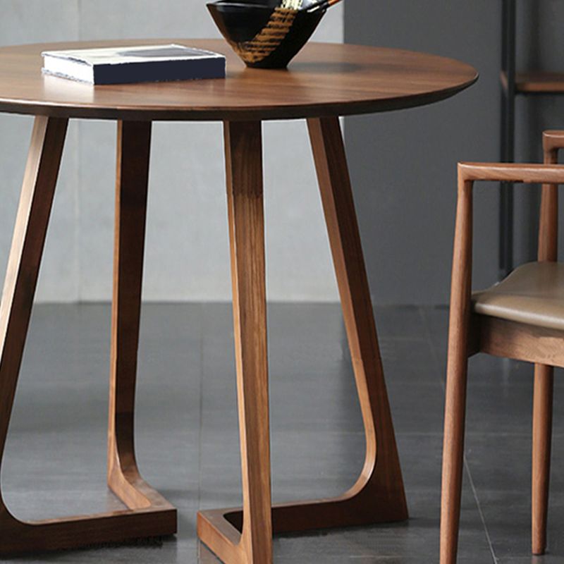 Tavolino a base di gambe incrociate in legno massiccio con cima rotonda