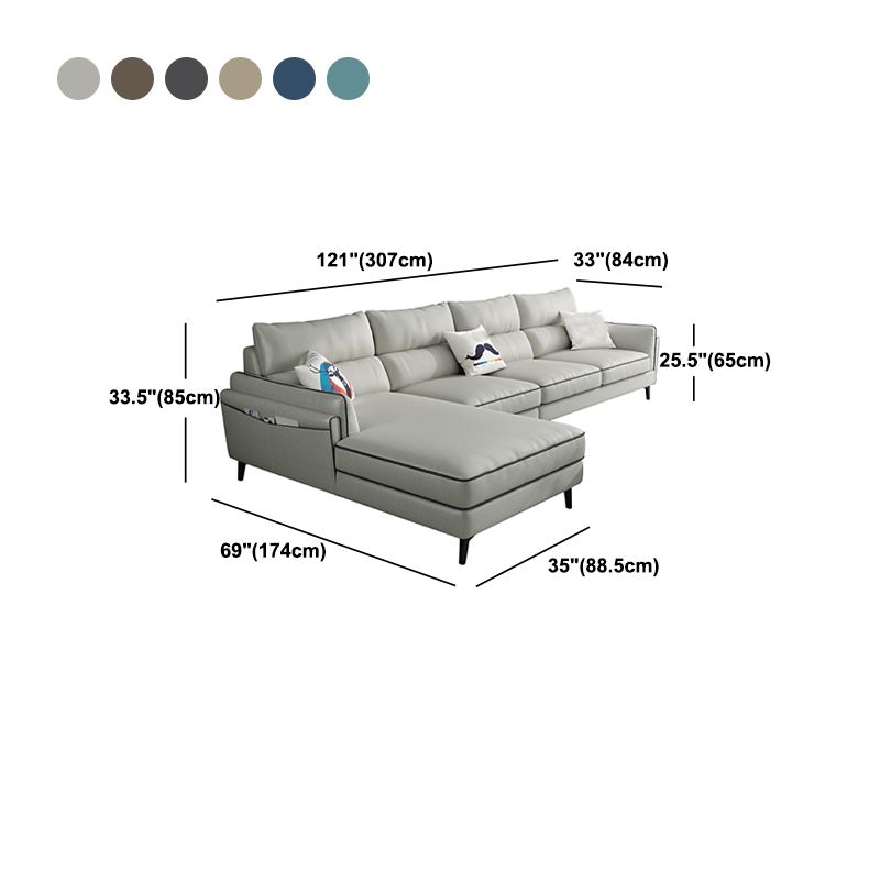 Sectionnel en faux cuir en L avec bras encastrés et rangement