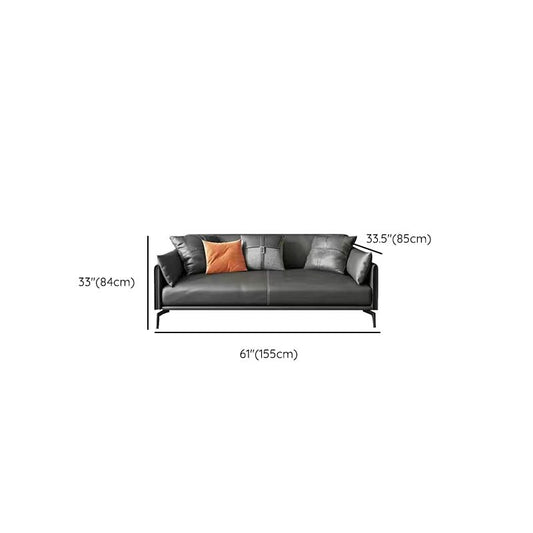 4本の脚と現代的なリビングルームの座席を持つ灰色の革ソファ