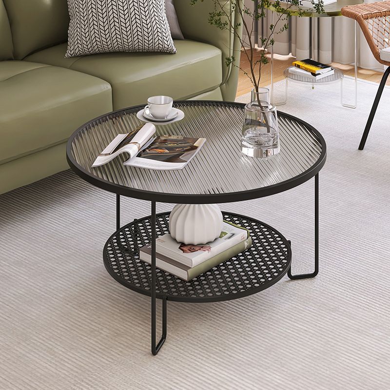 Tavolino moderno in vetro rotondo con 3 zampe di ferro e scaffale