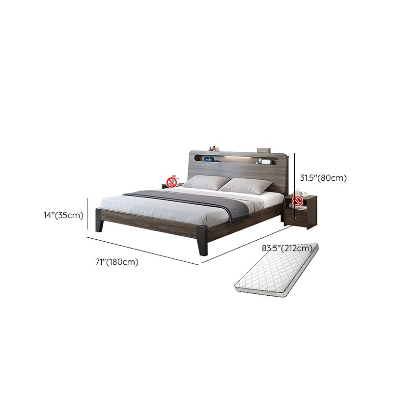 Lit standard en bois dans un lit de panneau gris avec tête de lit rectangulaire