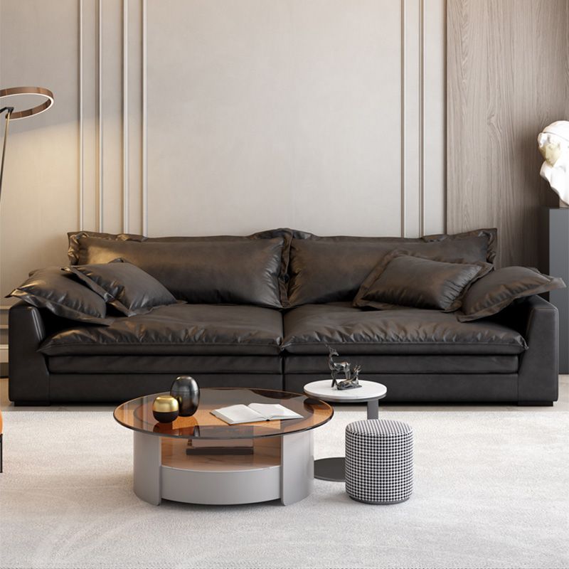 Soggiorno in vetro in pelle stazionaria in vetrino. Divano nero