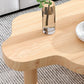 Table basse scandinave de forme libre avec 3 pieds en bois de pin