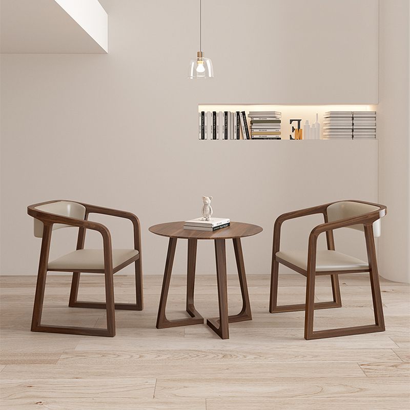 Tavolino a base di gambe incrociate in legno massiccio con cima rotonda