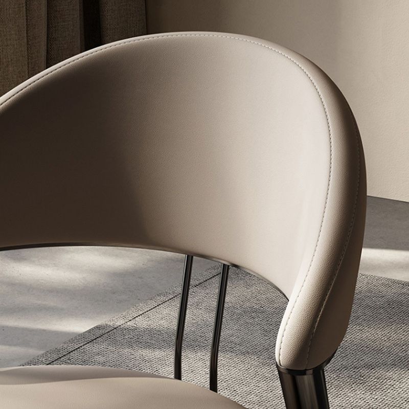 Minimalistische stijl armloze open achterkant stoelen faux lederen eetkamerstoelen