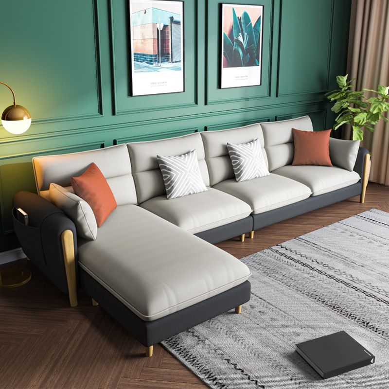 Divano sezionale del braccio rotondo con ottoman sezionale in pelle finta