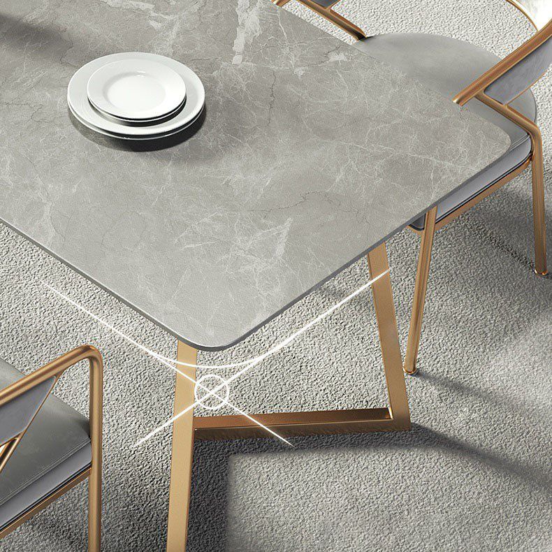 Mesa de comedor de lujo tradicional mesa rectángulo de piedra sinterizada con base de oro