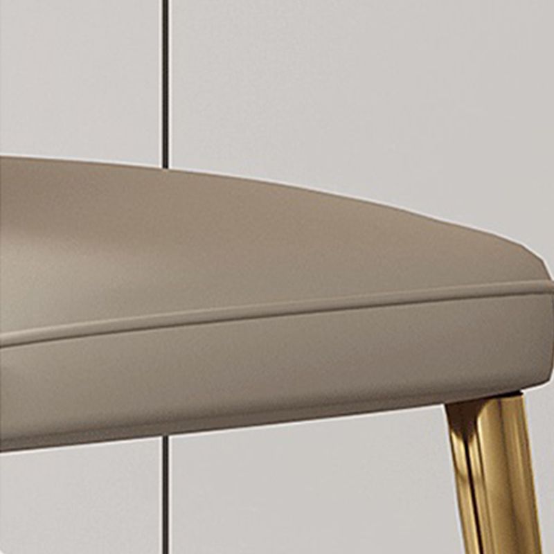 Glam -eetkamerstoel faux leer en metalen armloze eetkamerstoelen