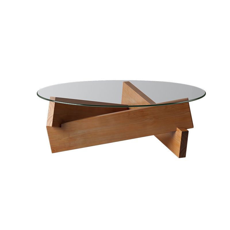 Moderner runder Couchtisch mit Glasplatte und abstraktem Holzbein