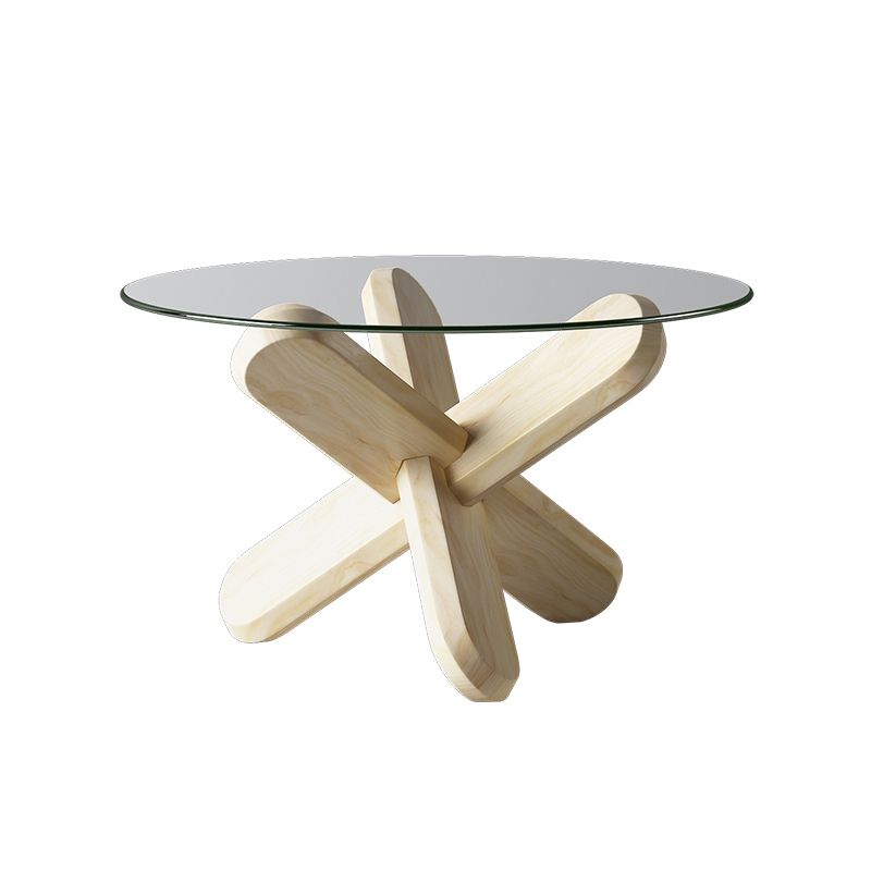 Moderner runder Couchtisch mit Glasplatte und abstraktem Holzbein