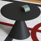 Moderne zwart/witte salontafel met ronde bovenkant, ijzeren voetstuk, cocktailtafel uit het midden van de eeuw