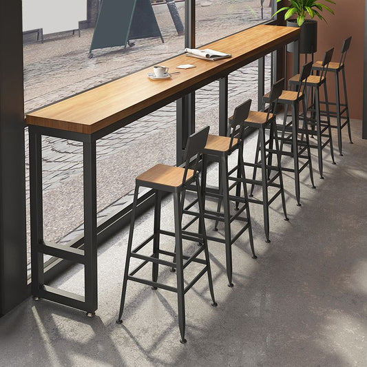 モダンなスタイルの長方形のバーテーブルソリッドウッドバーダイニングテーブルフットレスト