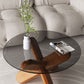 Moderner runder Couchtisch mit Glasplatte und abstraktem Holzbein
